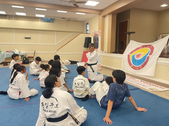 Words Before Training — Students gather on the mat as an instructor shares the lesson behind the techniq