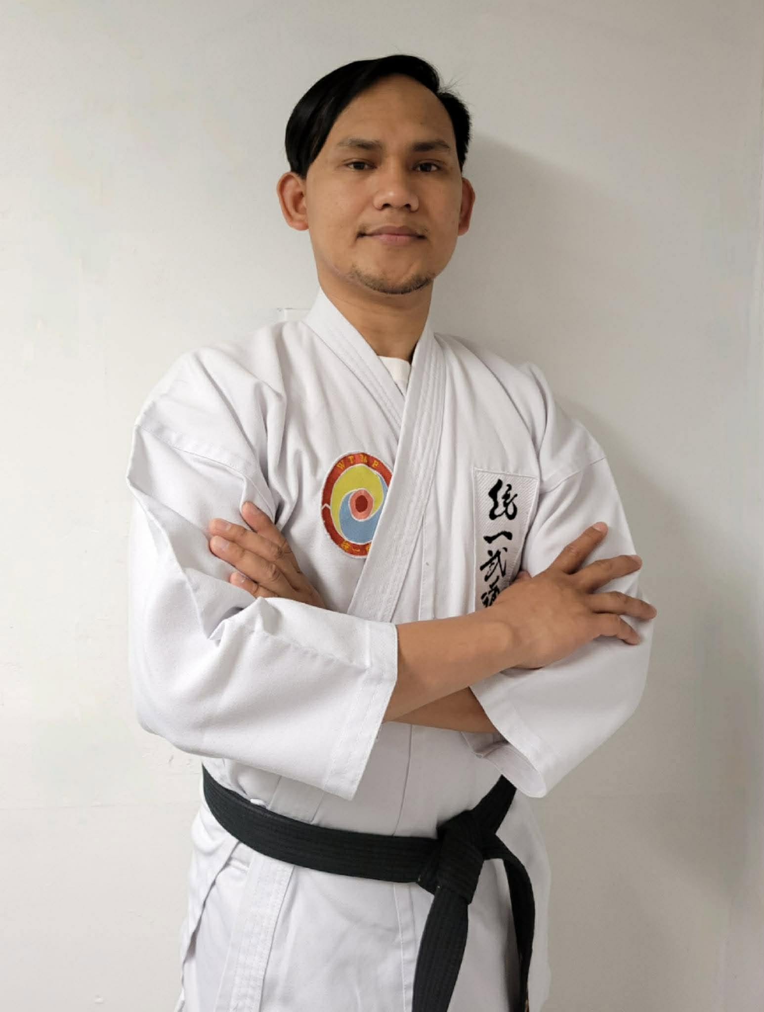 Werlo Partosa in his dobok, wearing the black belt and World Tong-il Moo Do Federation patch